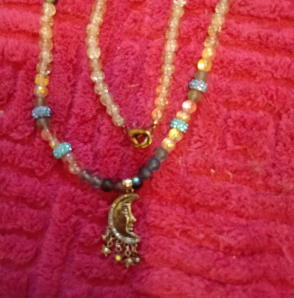 Elegant Gold and Blue Beaded Necklace with Crescent Pendant